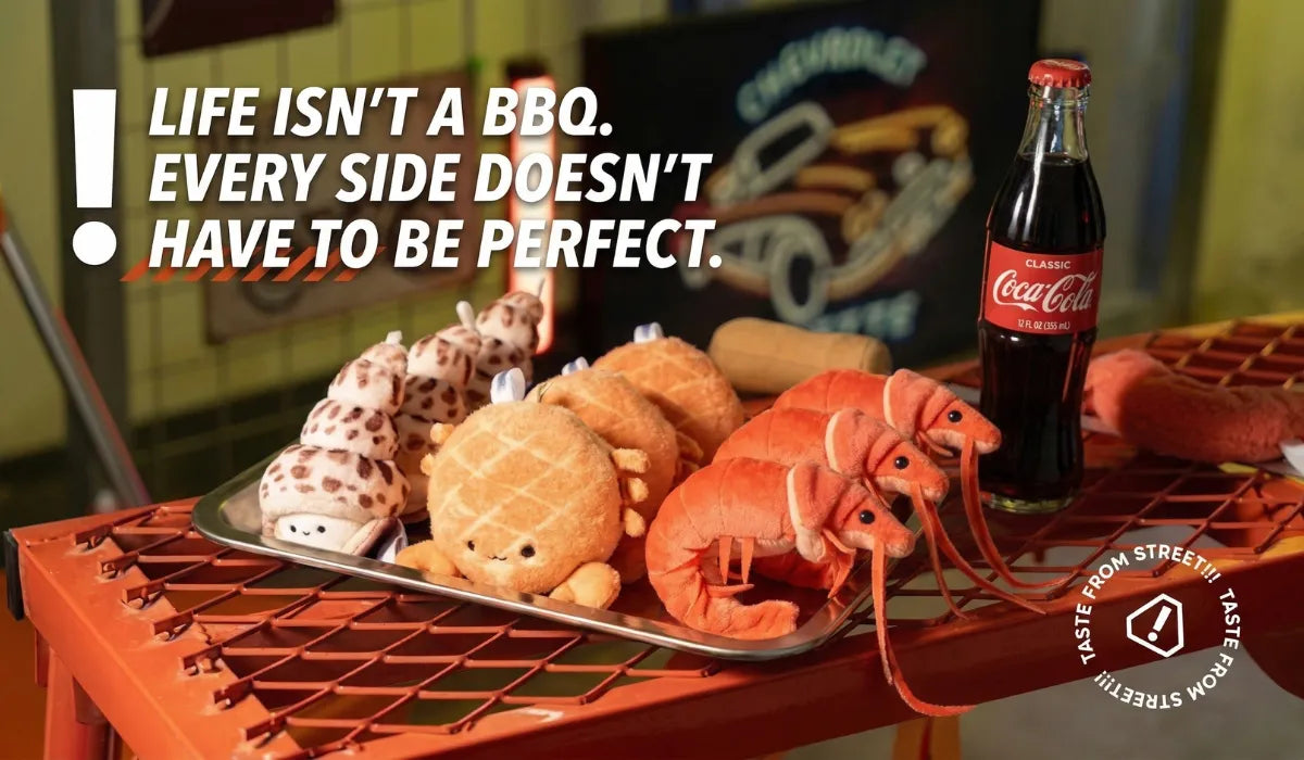 Plated food with a bottle of Coca-Cola on a grill, featuring a quote about life not being a BBQ.