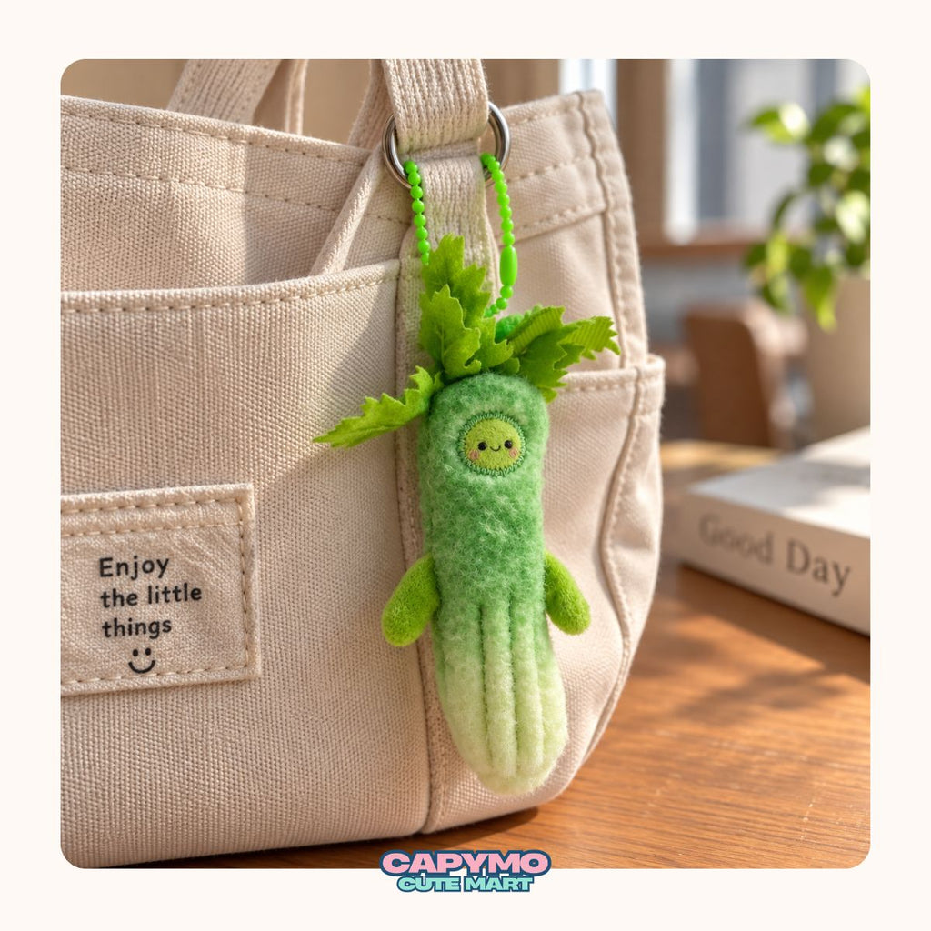A cute green felt vegetable character keychain or bag charm with leafy green top and small arms, hanging from a beige canvas tote bag on a wooden table.