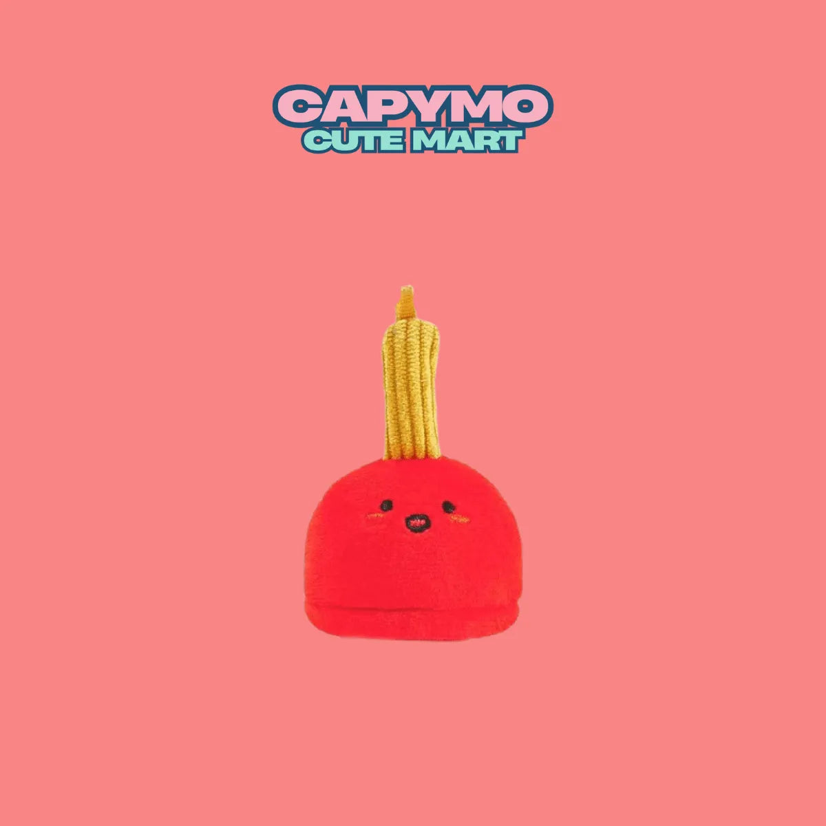 Red plush toy with a yellow top on a pink background, featuring the brand 'CAPYMO CUTE MART'.